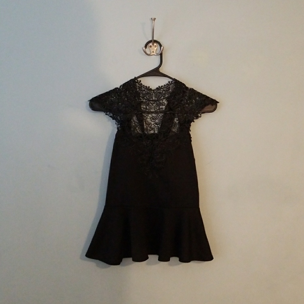Black peplum top with lace neckline
